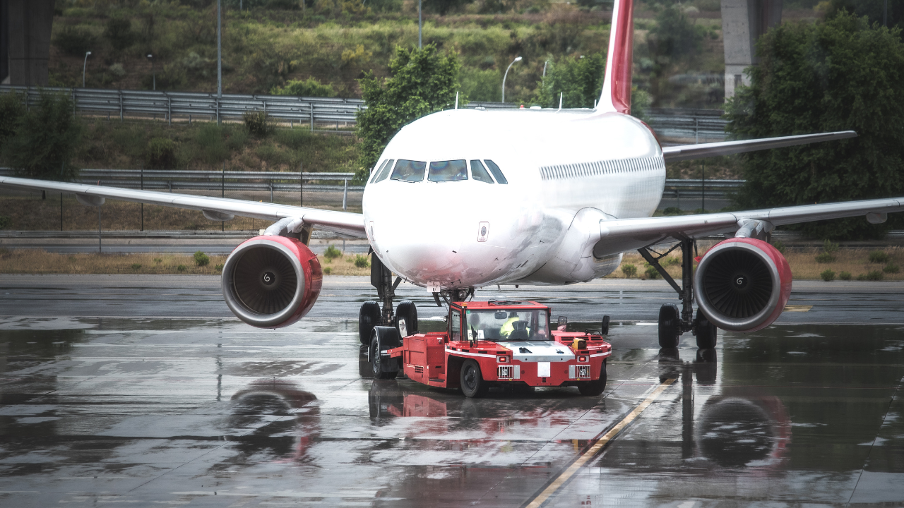 plane flying in rain